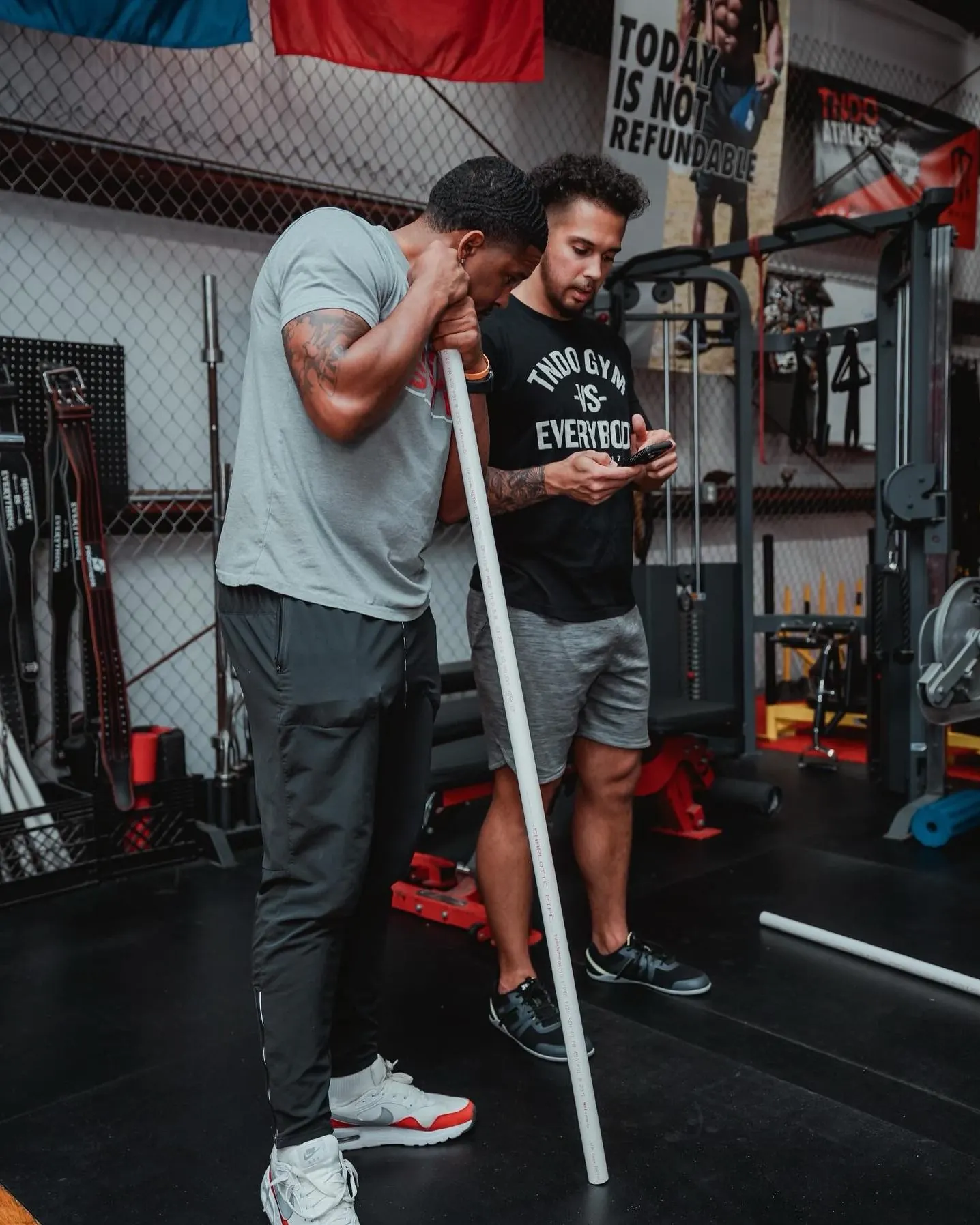 A TNDO coach reviews a member's rep on his phone